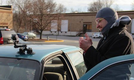Kevin attaching GoPro to car via suction mount